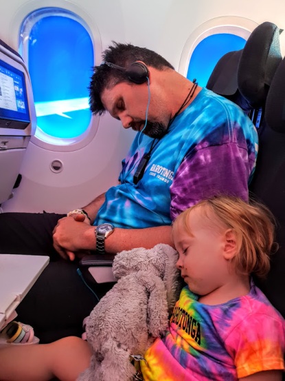 Rob and Rylee sleeping on plane